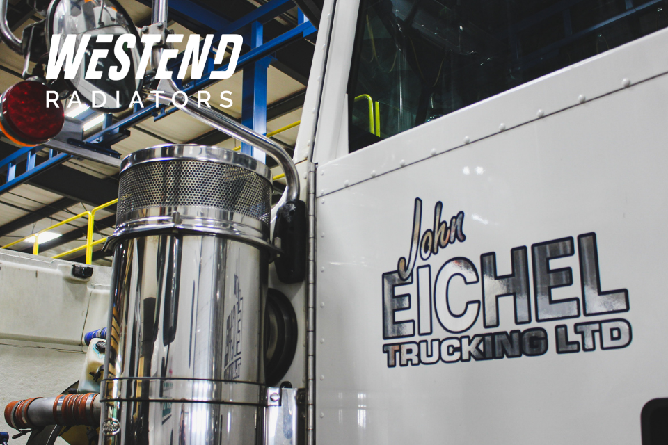 West End Rad logo on top of close up photo of John Eichel Trucking truck